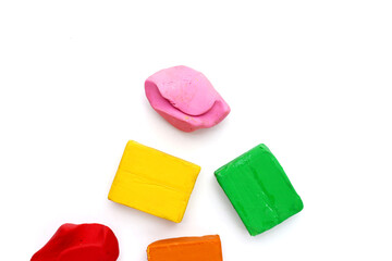 Colorful plasticine clay on white background.