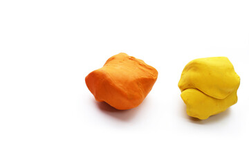 Colorful plasticine clay on white background.