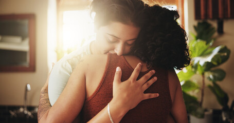 Lgbtq, couple and hug with love in home for romantic relationship, connection and affection with happiness. Woman, bonding and commitment in house for queer partnership, pride and embrace with care