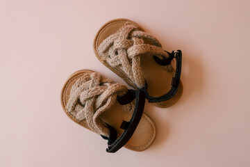 Children's sandals on pastel background, fashion