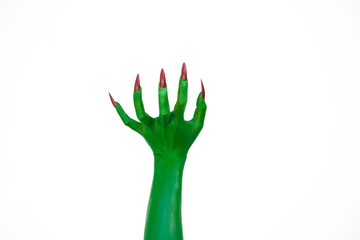 A green monster hand with long nails, isolated against a dark background, evokes horror and fear. Perfect for Halloween, this spooky image captures the essence of evil and the undead. © NanSan