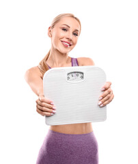 Happy woman with floor scale on white background