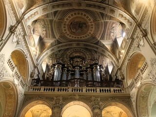 Interior of vintage church featuring ornate columns and arches