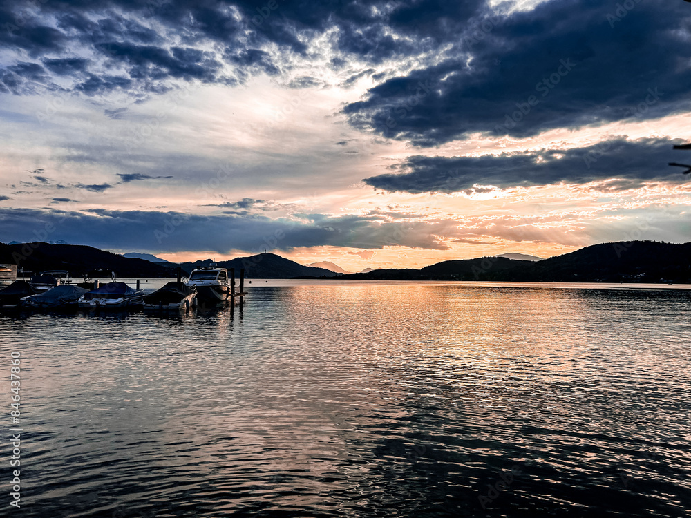 Poster Boats moored on Worthersee at sunset. Austria