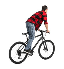 Naklejka premium Young man riding bicycle on white background
