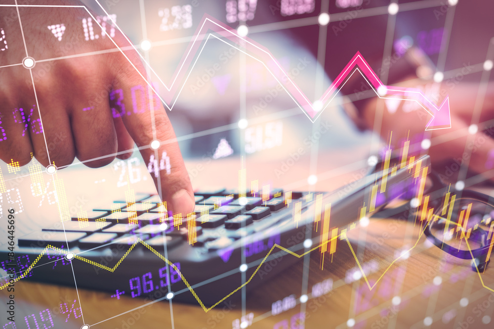 Poster Close up of male hand using calculator on desk glowing falling forex chart and index grid on blurry background. Crisis, accounting and financial recession concept. Double exposure.