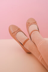 Pink shoes and tights on child's feet, fashion