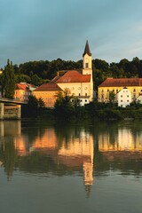 An image of a lake and a bridge with some buildings