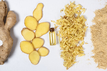 Ginger in different states - root, cut pieces, oil, grated, dry powder.