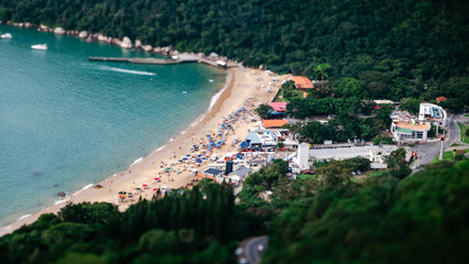 Crowded beach with a lake in the foreground