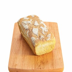 Loaf of bread with crust on wooden cutting board