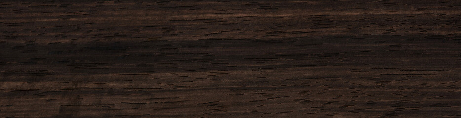 Ebony veneer surface with dark, enigmatic streaks and subtle texture