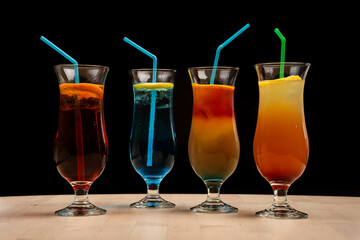 Four assorted beverages arranged in a line