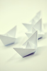 paper boats on the white