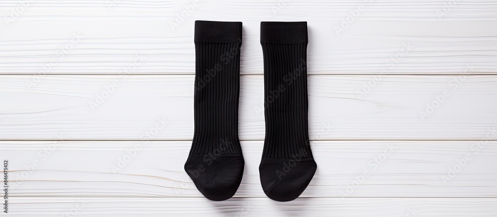 Poster pair blank black small low socks flat lay on white wood board side view mock up for design print pre