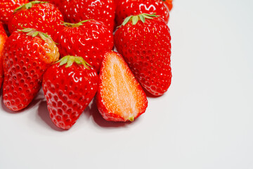 Closeup photo of red strawberry against white background
