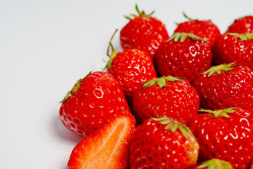 Closeup photo of red strawberry against white background