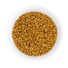 Buckwheat grains in a white plate. Top view. Isolated on transparent background. PNG format
