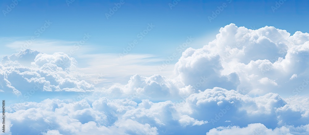 Poster the image features a captivating abstract background of blue sky and clouds providing ample space fo