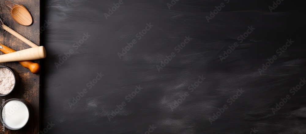 Poster Top view of a black ceramic table with a rolling pin and starch providing a copy space image for text on the side