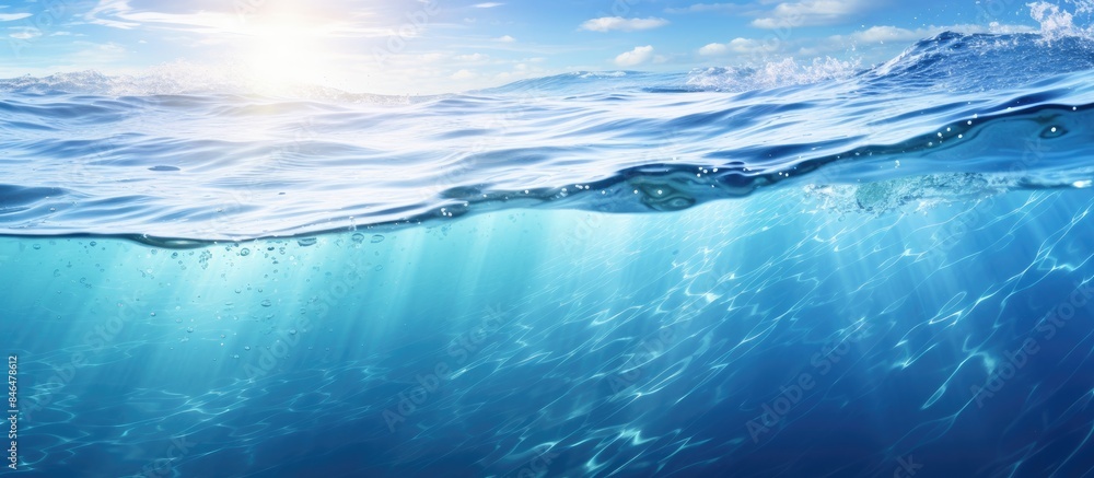 Aufkleber The transparent blue water has a sun glare creating a captivating wave texture background perfect for a copy space image