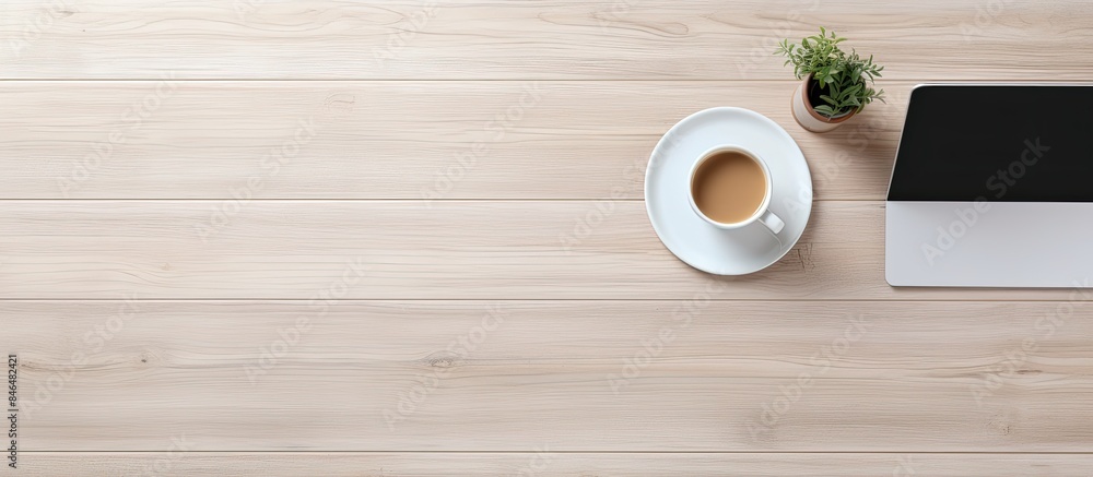 Aufkleber The office table is seen from above displaying a laptop a notepad and a cup of coffee There is enough free space for additional images or text