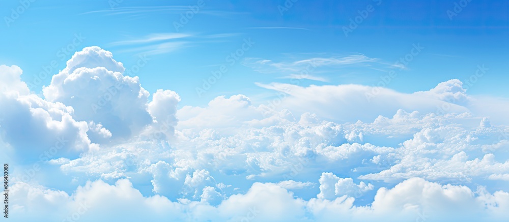 Poster The clear blue sky with fluffy clouds provides ample room for adding text or images