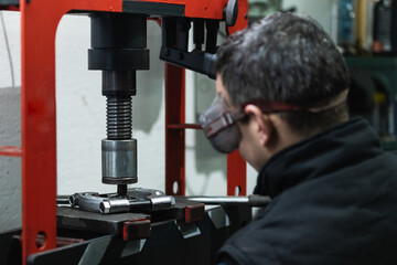 Auto mechanic working at garage