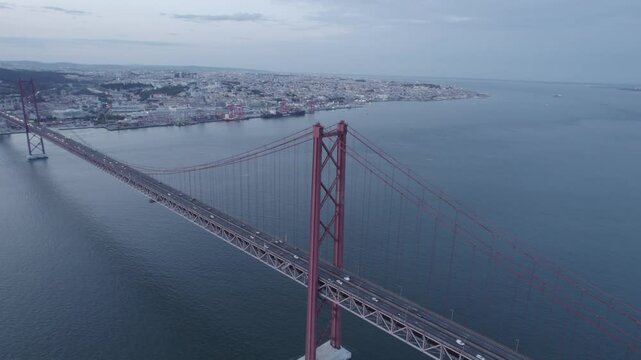 25 April Bridge and Sanctuary of Christ the King-Portugal seen in the background in Lisbon, Portugal