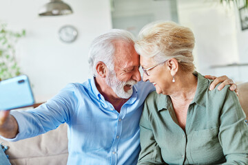 senior woman man couple elderly love elderly selfie camera mobile phone smartphone photo picture portrait male old together active vitality cell phone hug