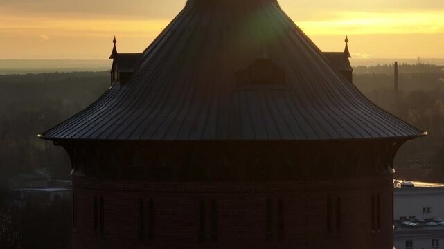 Drone footage of the historical Water Tower (Wasserturm) at sunrise in Forst (Lausitz) town, Germany