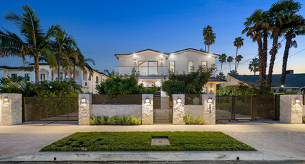 Obraz premium House with a beautiful garden and metal gates. California, USA