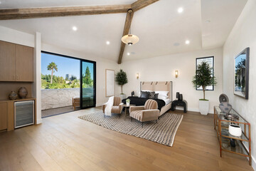 Interior of a bedroom with wooden floors and a view outside