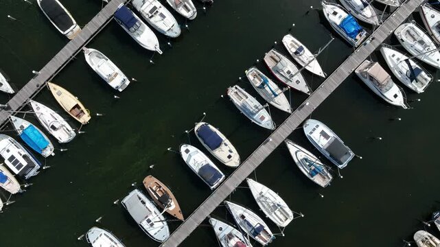 Top down drone shot of De Knar Harbor on Veluwemeer lake on a sunny day in Harderwijk, Netherlands