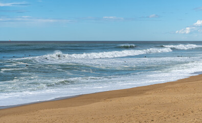 Surfers Sea Waves on Sandy Beach Texture Background, Transparent Ocean Water, Blue Sky, Sunny Shore