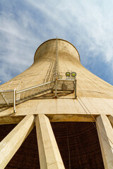 Giant cooling tower in a factory in blue sky background from different perspectives