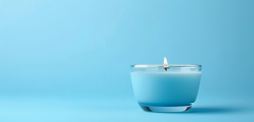 white candle wax and candle in the white cup with text copy space isolated against the blue background 