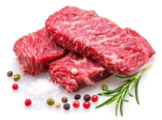 Raw pieces of beef with peppercorn and rosemary isolated on white background. Closeup.