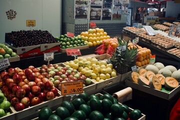 A colorful display of fresh fruits and vegetables at Queen Victoria Market