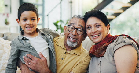 Portrait, grandparents and child on sofa at house for hug bonding, love and relax with care on weekend break. Woman, man and boy gratitude embrace, family support and security together in lounge