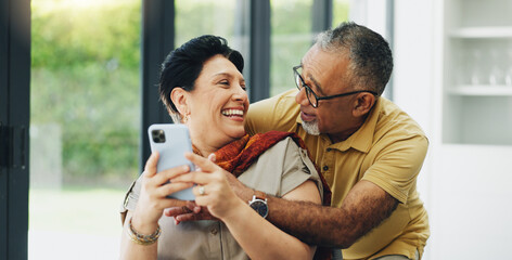 Cellphone, hug and senior couple in home reading online blog together for news on election...