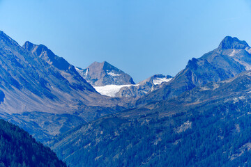 Scenic view of mountain Valley Bedretto in the Swiss Alps with mountain peak on a sunny late summer day. Photo taken September 10th, 2023, Gotthard, Canton Ticino, Switzerland.