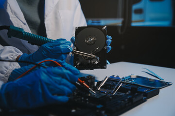 Obraz premium Close up of Technician measuring voltage electronic circuit board television, Service after sale fix electric equipment within insurance.
