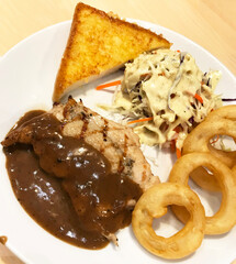 Grilled Chicken and Black Pepper Sauce with Toasted, Salad and Onion Ring