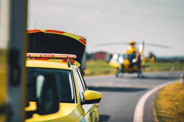 Selective focus on red light flasher on roof of ambulance car of emergency medical service against...