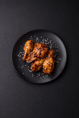 Delicious crispy grilled wings with teriyaki sauce with salt, spices