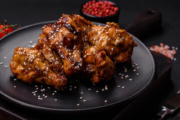 Delicious crispy grilled wings with teriyaki sauce with salt, spices