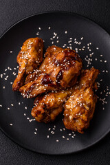 Delicious crispy grilled wings with teriyaki sauce with salt, spices