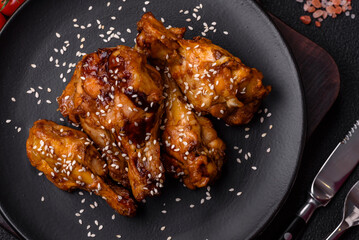 Delicious crispy grilled wings with teriyaki sauce with salt, spices