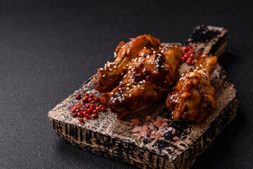 Delicious crispy grilled wings with teriyaki sauce with salt, spices